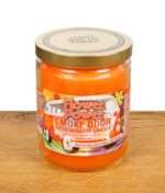 Smoke Odor Exterminator Candle in der Duftrichtung Flower Power mit goldenem Deckel und buntem Etikett im Hippie-Design.