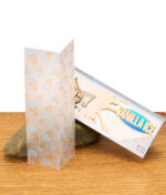 Geöffnete Packung Juicy Jay's Vanilla Ice Papers mit sichtbaren Blättchen im 1 1/4 Format