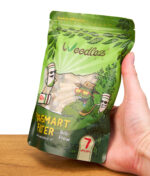 Weedlez Smart Filter Big Flow 250er Packung mit 7 mm Filtern wird in der Hand gehalten