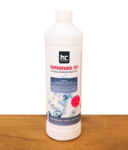 Weiße Flasche mit70% Isopropanol auf Holz stehend