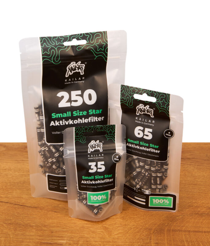 Kailar Small Size Star Aktivkohlefilter in den Packungsgrößen 35, 65 und 250 Stück auf einer Holzoberfläche.